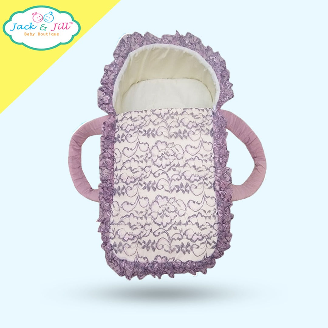 White & purple moses basket